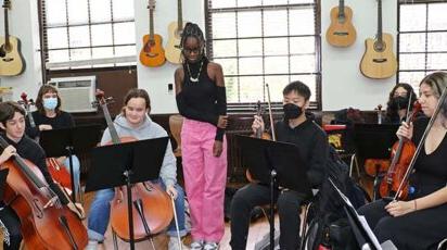 Jordan Millar listens as fellow students rehearse her string composition.